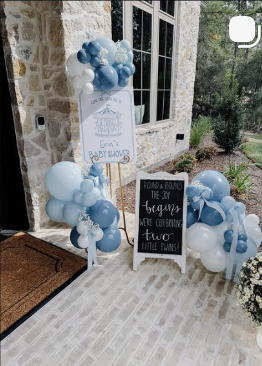 Blue baby shower sign with balloons