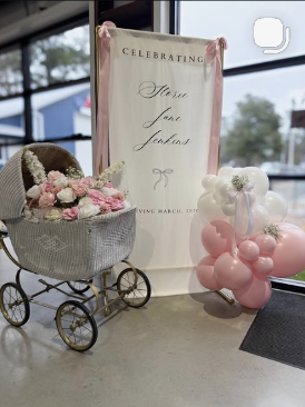 Tea party display with stroller and balloons
